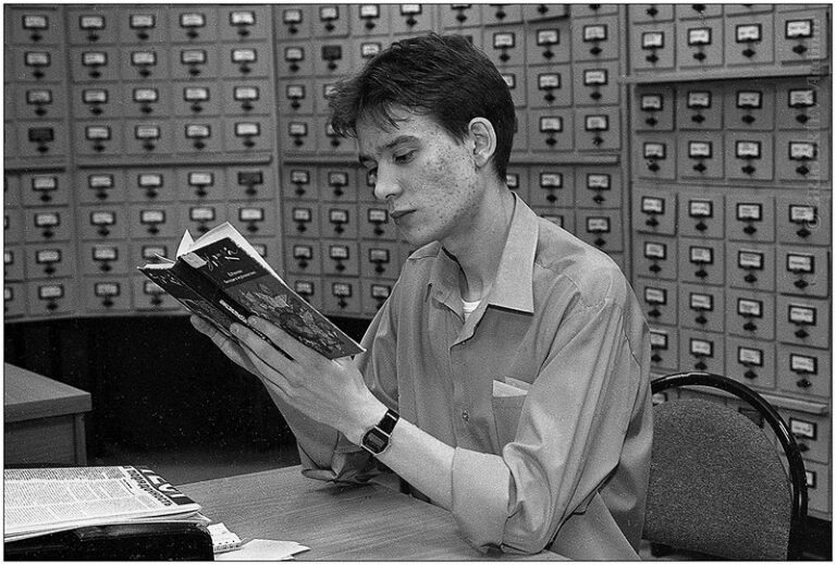 Person reading a book, focused on the page